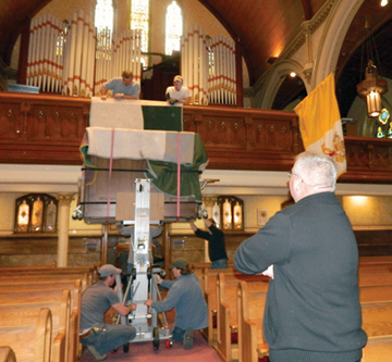 New organ gets a lift at St. Gregory's church. Photo by Bill Forry